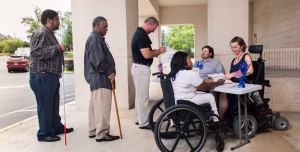 Line of people at information table